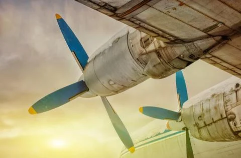 Plane flying into the sunset Stock Photos