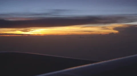 Plane Flying At Sunset from window Stock Footage 49090673