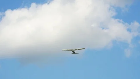 Plane flying through clouds in the sky. Jet aircraft in the air. Stock Footage 77767087