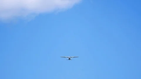 Plane flying through clouds in the sky. Jet aircraft in the air. Stock Footage 77767092