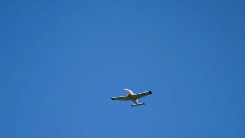 Plane flying through clouds in the sky. Jet aircraft in the air. Stock Footage 77767095