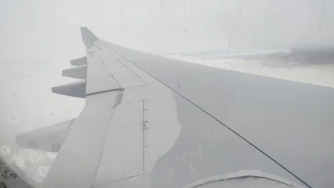 Plane flying through cloudy sky window perspective Stock Footage 122662700