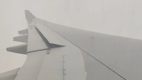 Plane flying through cloudy sky from cabin window perspective Stock Footage 122662705