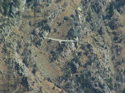 Plane flying through Rocky Mountains 01 Stock Footage 24653533