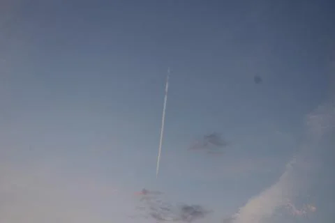 Plane flying through the sky Stock Photos