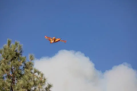 Plane flying through smoke Stock Photos