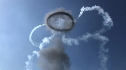 Plane flying through smoke ring Video stock 134731461