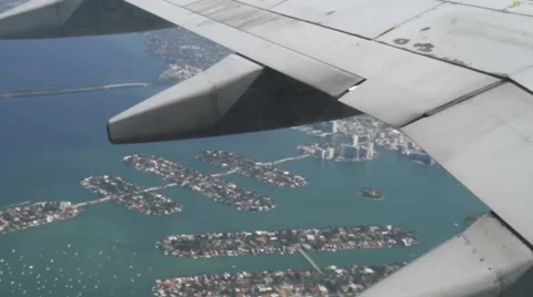 Plane flying from window florida Stock Footage 973089
