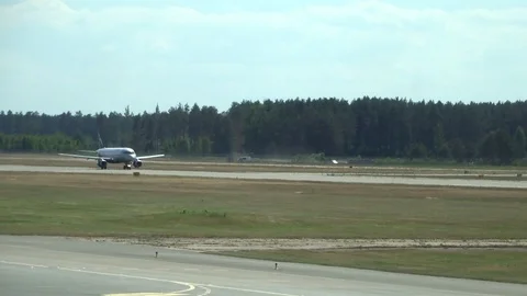 The plane is gaining speed on the runway Stock Footage 95593912