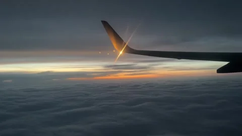 The plane glides gracefully over a sea of ​​white clouds Stock Footage 294262449