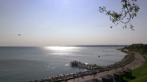 The plane goes down over the sea at sunset Stock Footage 69011713