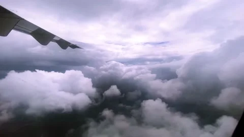 A plane is going into clouds  . beautiful cloudy sky . Stock Footage 161012597