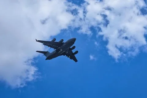 A plane gracefully soaring through the azure sky. Foto stock