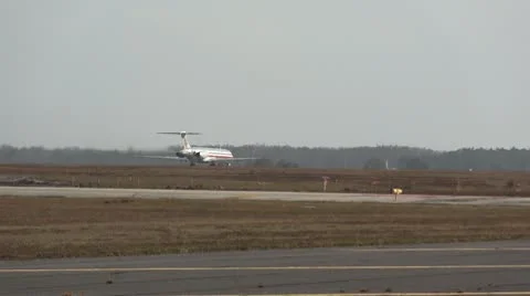 Plane heading down runway Stock Footage 10734646