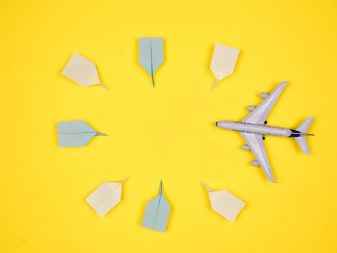 Plane heading to paper planes Stock Photos