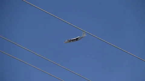 Plane heads towards fire to help put it out Stock Footage 114413389