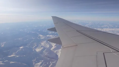 Plane inflight window view of flying over the European Alps Stock Footage 304263907