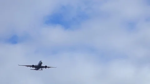 Plane jet flies through the sky 4K Stock Footage 126828788
