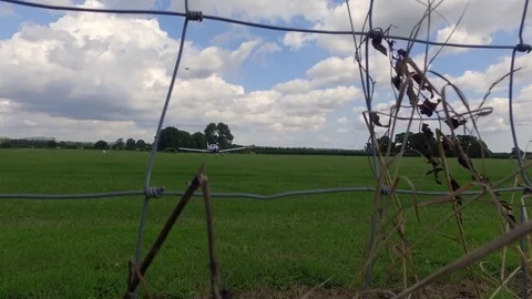 Plane Landed On The Field, view through the fence 스톡 동영상 82779042