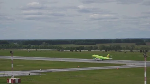 The plane landed on the runway in the evening at sunset at the airport. Russia Stock Footage 84594853