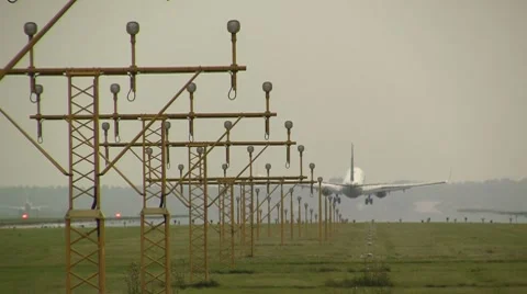 Plane landing on cloudy day Stock Footage 8552169