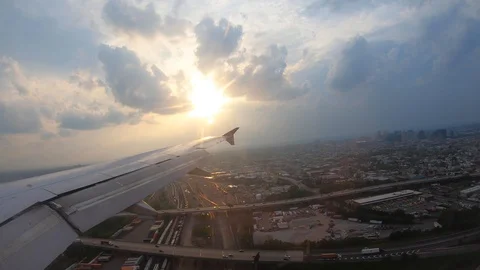 Plane landing during a sunset Stockbeeldmateriaal 110825222