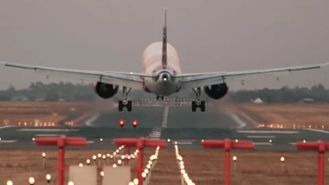Plane landing at dusk. Aircraft Arriving at airport. Transportation. Travel Stock Footage 220175003