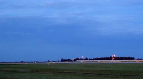 Plane Landing In the Evening Stock Footage 41063763