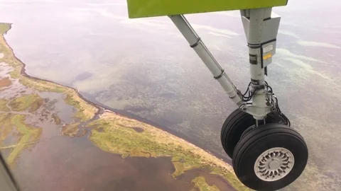 Plane Landing Gear Wheels Flying Over Sea Ocean Land Houses Close Stock Footage 119333629