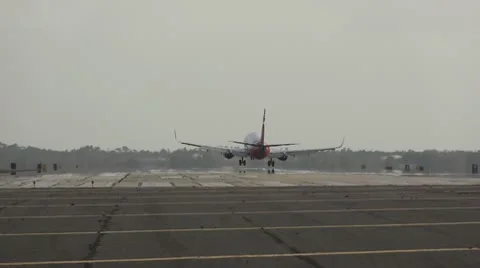Plane landing at international airport Stock Footage