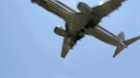 Plane Landing Low with a Pan Stock Footage 11188547