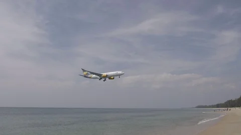 Plane Landing Over the Beach Stock Footage 87596769
