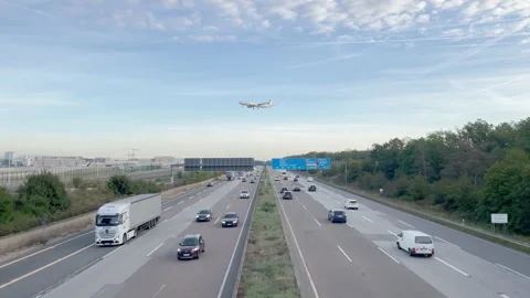 Plane landing over dense Traffic On German Highway A5 nearby Frankfurt Airport. Stock Footage 188305686