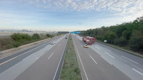 Plane landing over dense Traffic On German Highway A5 nearby Frankfurt Airport. Stock Footage 188306231
