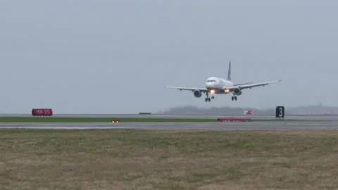 Plane Landing on Runway Stock Footage 146995412