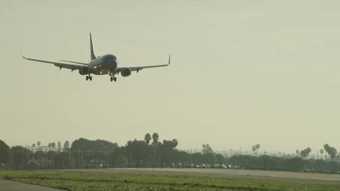 Plane landing on runway Stock Footage 197493260