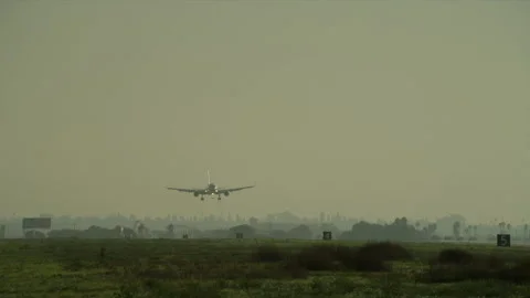 Plane landing on runway Stock Footage 197493526