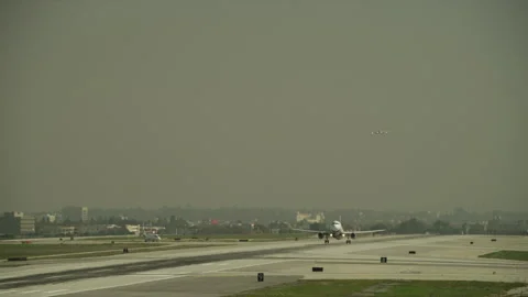 Plane landing on runway Stock Footage 197494976