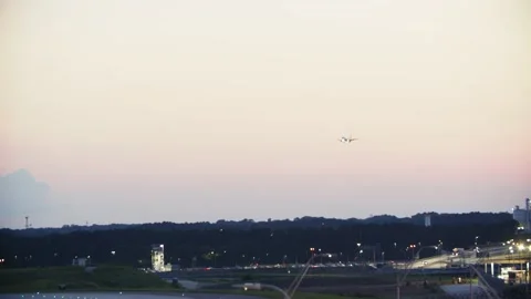 Plane landing sunset 4k Stock Footage 161251047