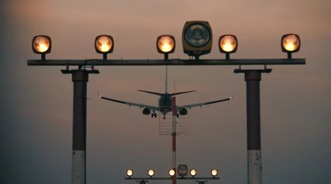 Plane landing at sunset Stock Footage 60084597