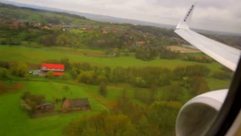 Plane is landing. View from the airplane window Stock Footage 77959423