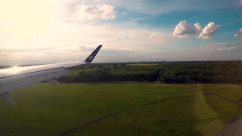 Plane landing wing view Stock Footage 135393268