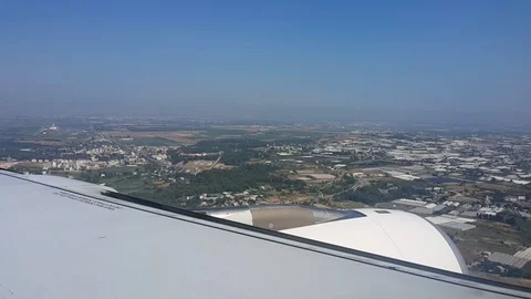 The plane lands above the city Stock Footage 101978481