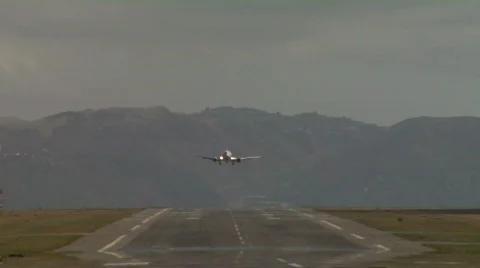 Plane lands with puff of smoke Stock Footage 309669