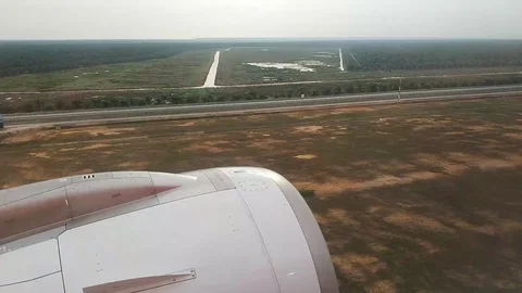 The plane lands on the runway. View of the wing with the turbine of the aircraft Stock Footage 101467288
