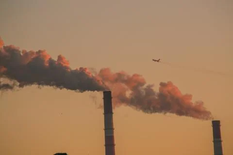 The plane lands at sunset Stock Photos