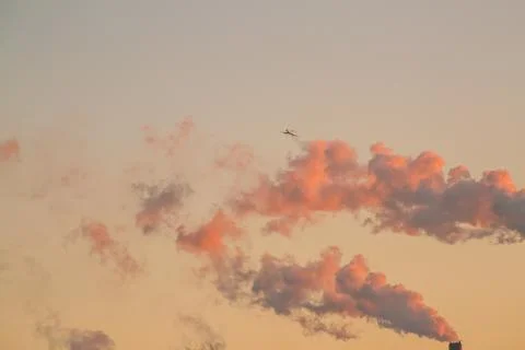 The plane lands at sunset Stock Photos