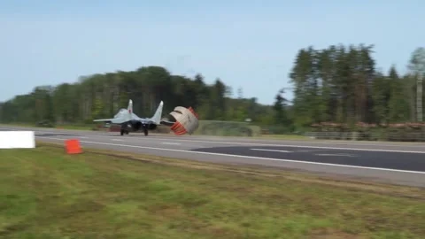 The plane lands on the track Stock Footage 140772532