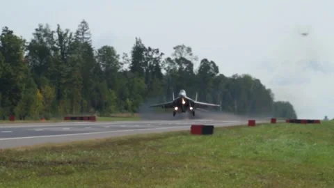 The plane lands on the track Stock Footage 140772576