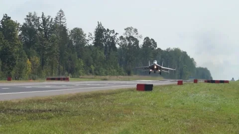 The plane lands on the track Stock Footage 140772601